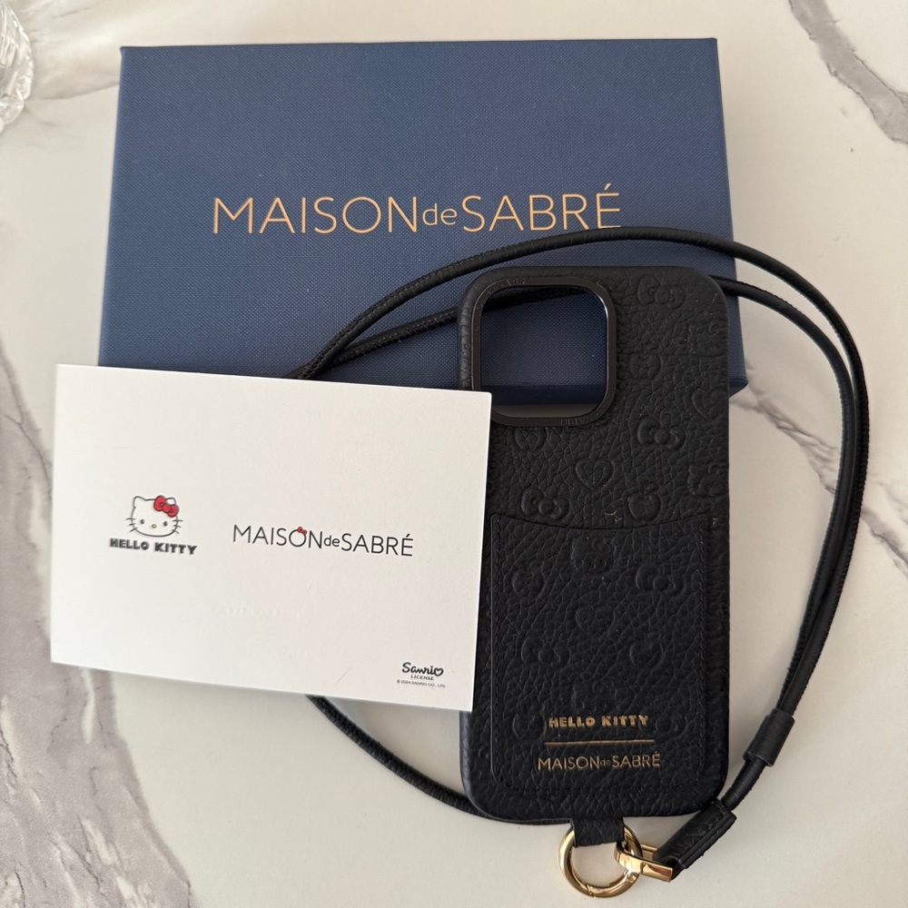 Maison de Sabré x Hello Kitty Black Leather iPhone 16 Pro Max Case w/ Strap